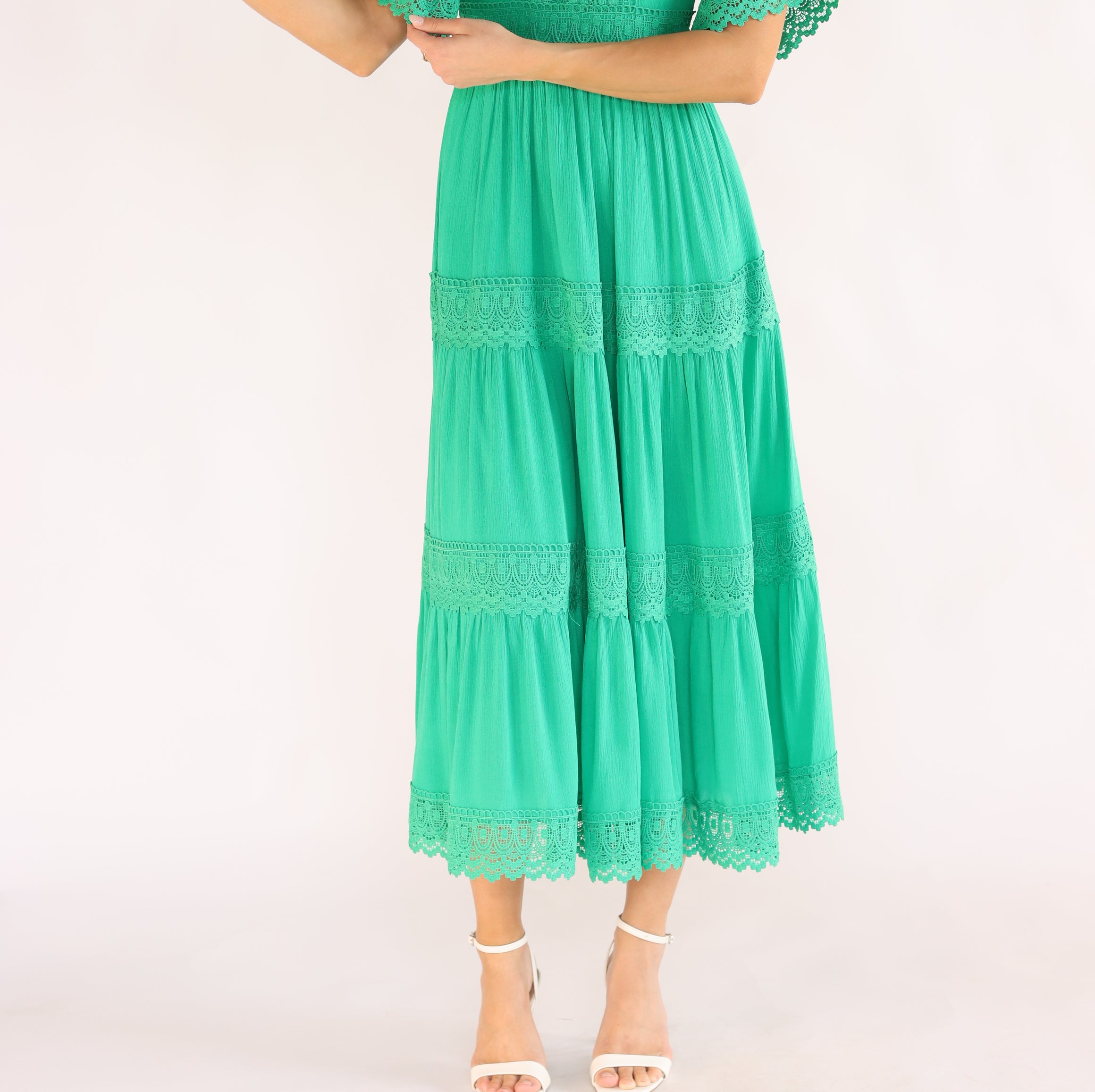 Woman wearing a green dress with half sleeves