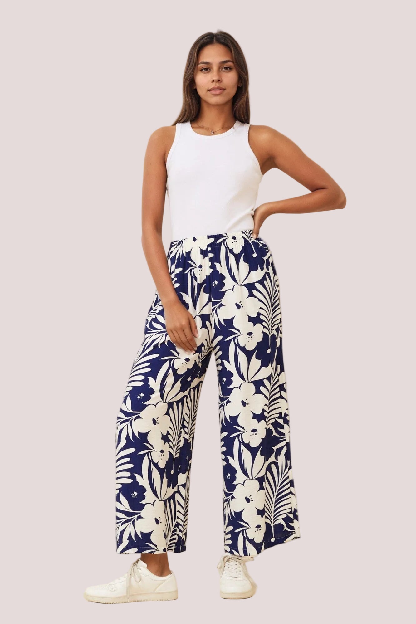 Woman wearing navy floral pants WIDE LEG STYLE