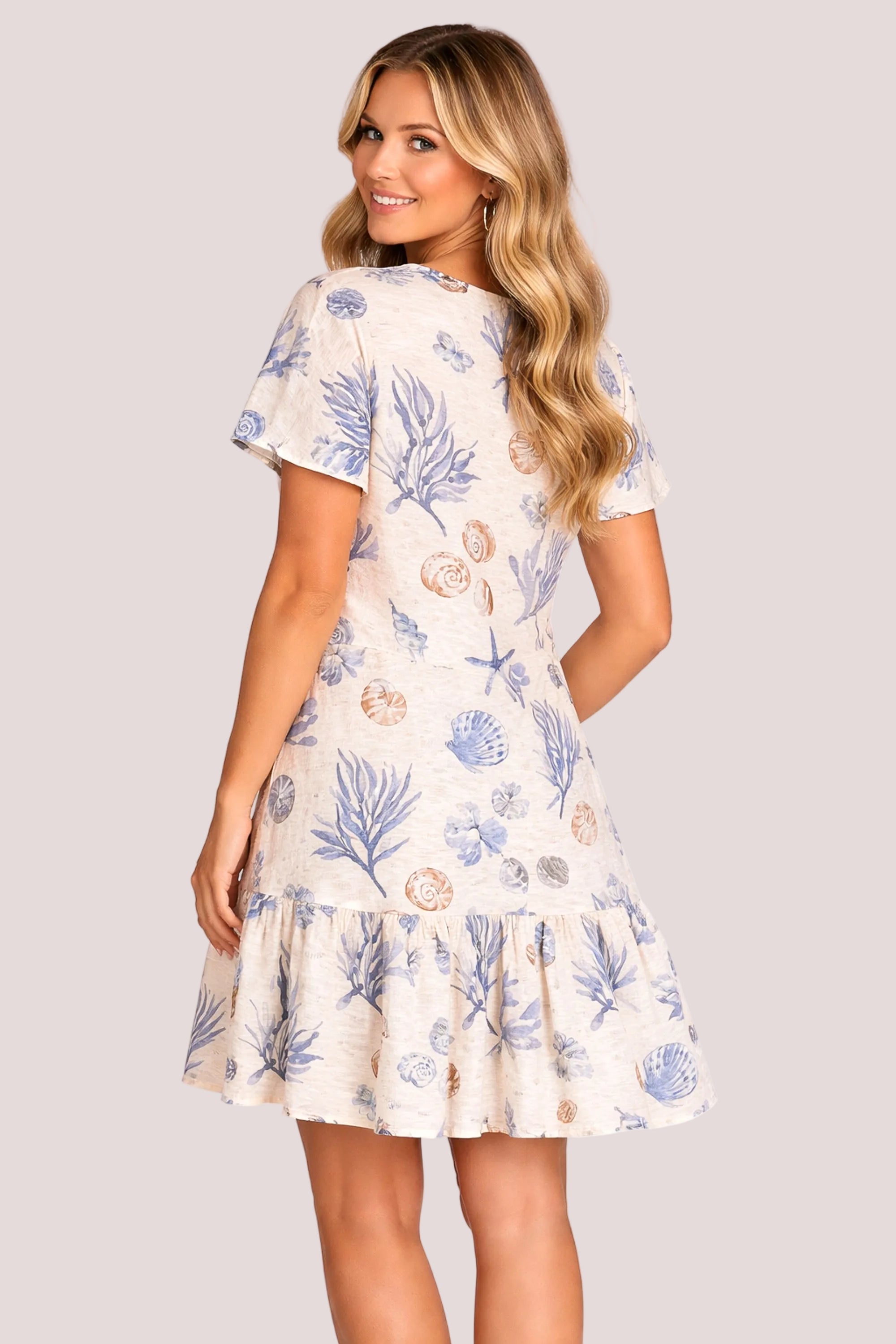 Woman wearing a floral dress on a white background