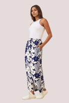 Woman wearing a blue navy pants with side pockets